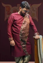 Men’s maroon traditional kurta panjabi with asymmetrical gold embroidered panel and metallic gold pants