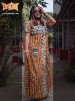 Boriby women’s long kurti with gray floral panel, orange striped sides, and front pockets, accessorized outdoors