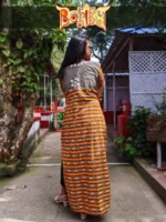 Boriby women’s long kurti in orange and brown stripes with floral embroidery on the back, styled outdoors