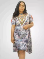 Hand‑embroidered printed linen one‑piece dress with pleated sleeves, front view