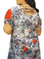 Hand‑embroidered printed linen one‑piece dress with pleated sleeves, back view