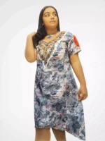 Hand‑embroidered printed linen one‑piece dress with pleated sleeves, side view
