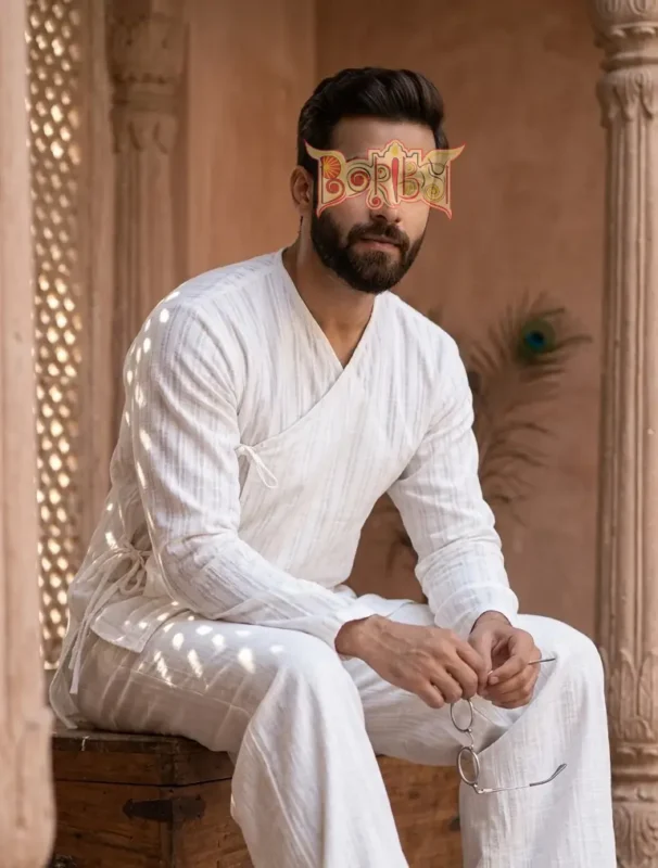 Model wearing Boriby Angarakha White Self Stripe Cotton Kurta for Men in cultural setting with premium cotton texture