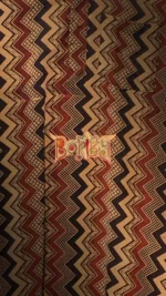 Ajrakh cotton fabric with traditional block print design in indigo, maroon, and beige