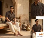 Man seated in rustic setting wearing Boriby Ajrakh Printed Half Shirt with white pants
